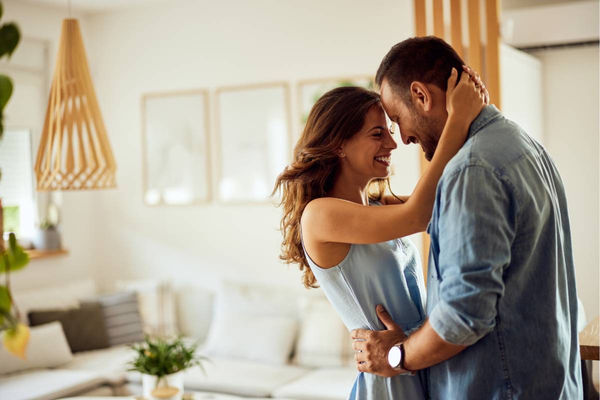 couple hugging at home