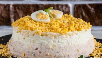 Mimosa salad for Christmas and New Year's Eve. Creamy like vegetable, but with a distinctive addition