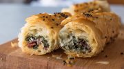 Puff pastry with spinach and salami. A simple and filling party snack