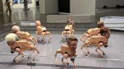 Robot dogs with heads like Musk, Bezos and Zuck defecate AI-made art. It's an installation