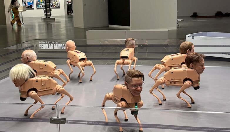 Robot dogs with heads like Musk, Bezos and Zuck defecate AI-made art. It's an installation