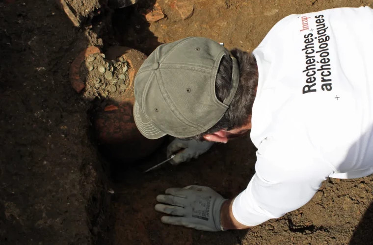 French archaeologists have discovered ancient vessels filled with Roman coins