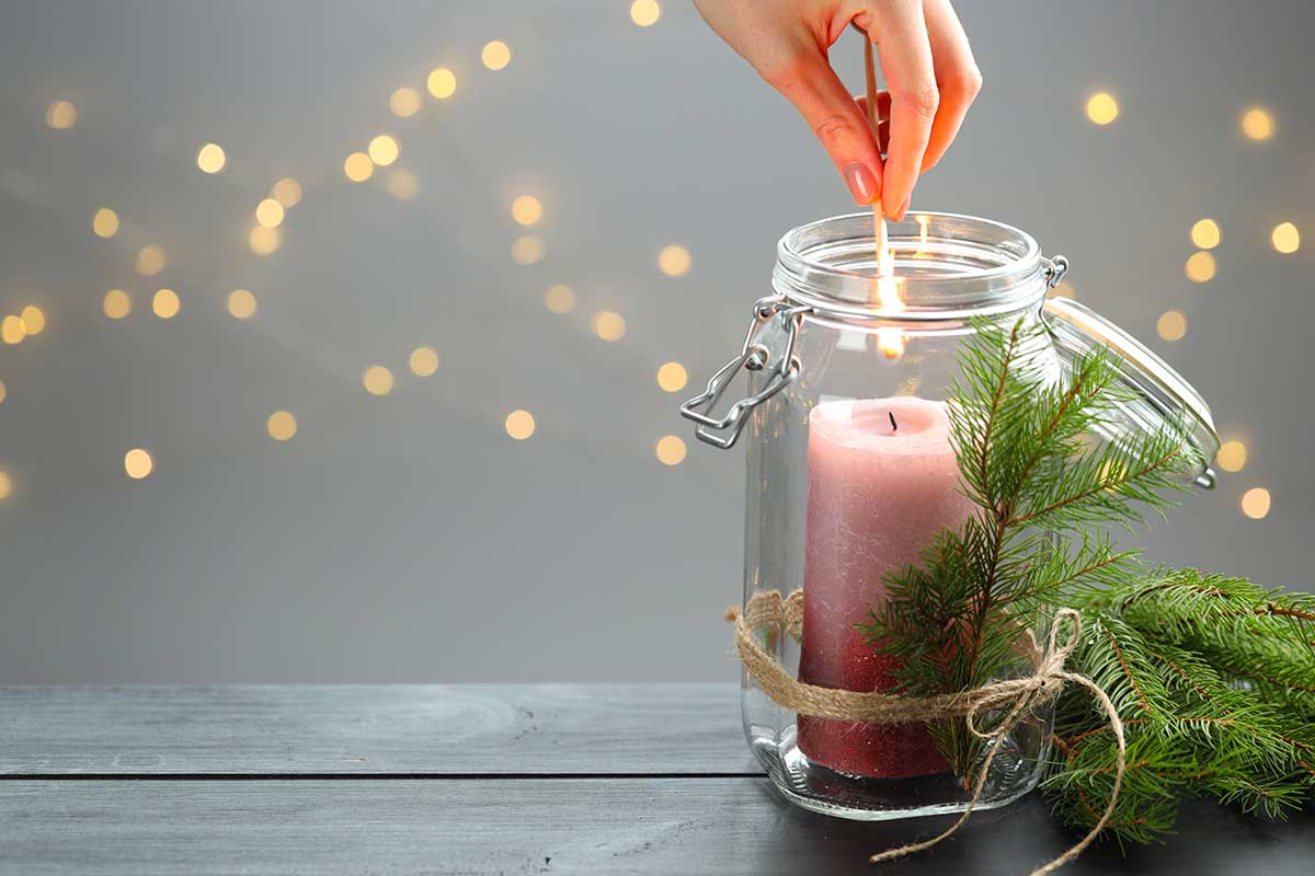Recycled jar decorated with a pine branch
