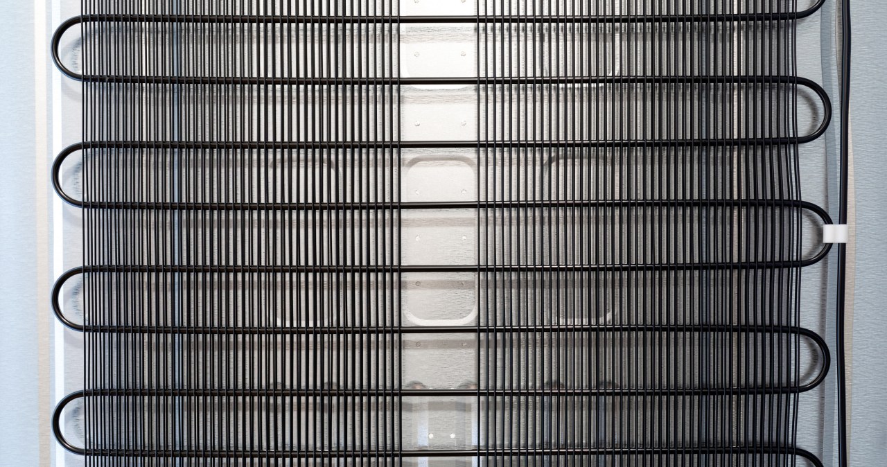 A dirty grill at the back of the refrigerator is one of the most often overlooked problems. /123RF/PICSEL /Pixel