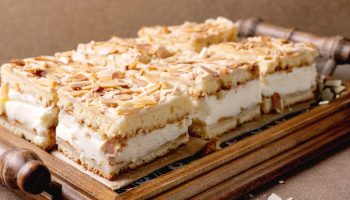 Royal cake with vanilla cream and meringue. Bake them on Twelfth Night