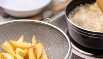 Add to fries before frying. They will be golden, perfectly crispy and will not absorb fat