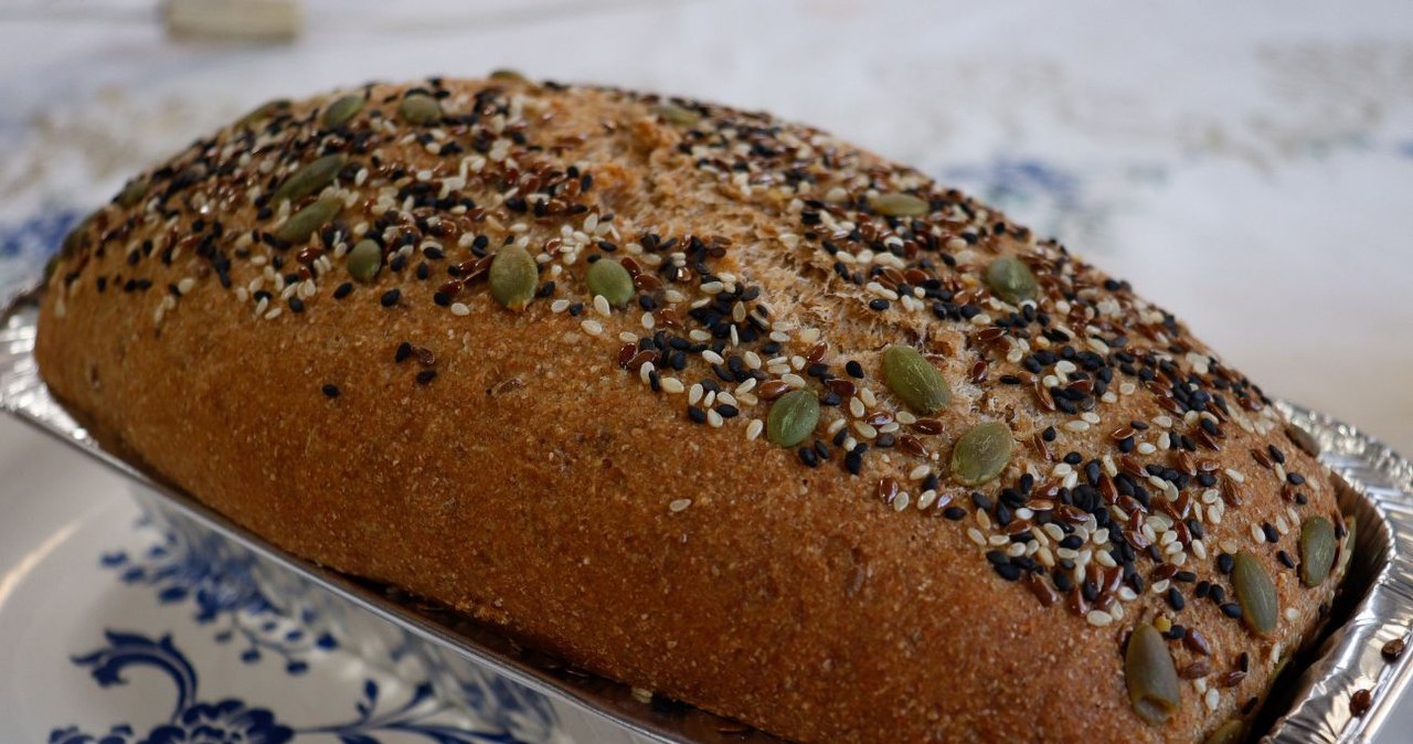 There is as much as 5 grams of protein in one slice. It is a combination of whole grain, seeds and broad beans