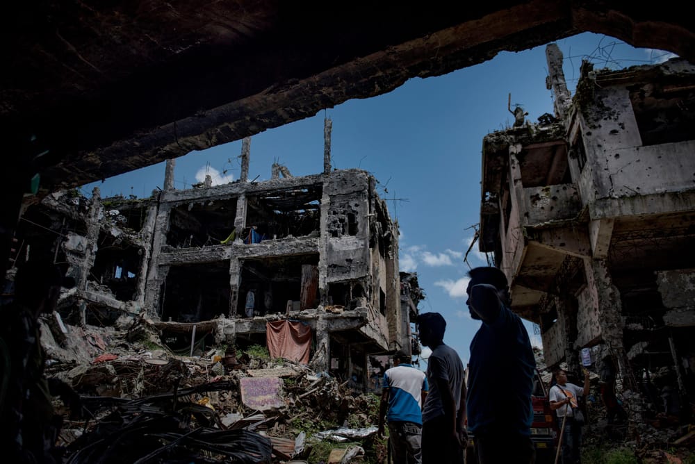 Marawi residents return to their homes in what used to be the main battle area during the war, on May 10, 2018, in Marawi, Philippines. (Jes Aznar/Getty Images)
