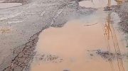 Video shows street filled with holes and puddles of water in the interior of Acre