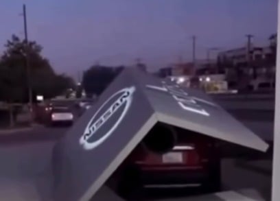 Woman crashes brand-new car shortly after leaving the dealership and the scene draws attention