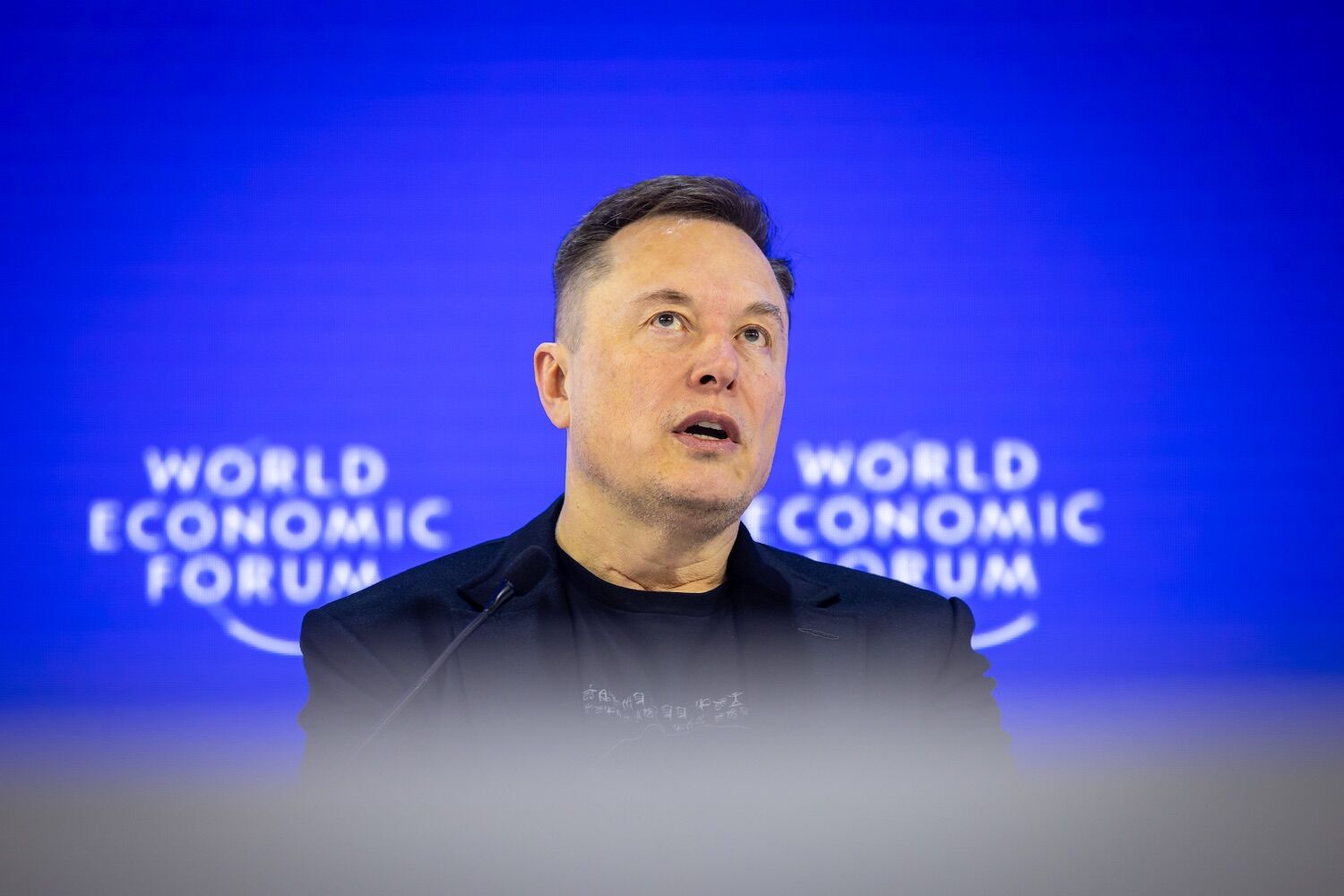 Musk surprises at Davos. Aging resolves itself, obsolete work, and peace or pieces