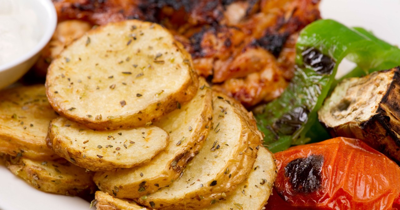 Baked potato slices with herbs. An insanely delicious addition to dinner