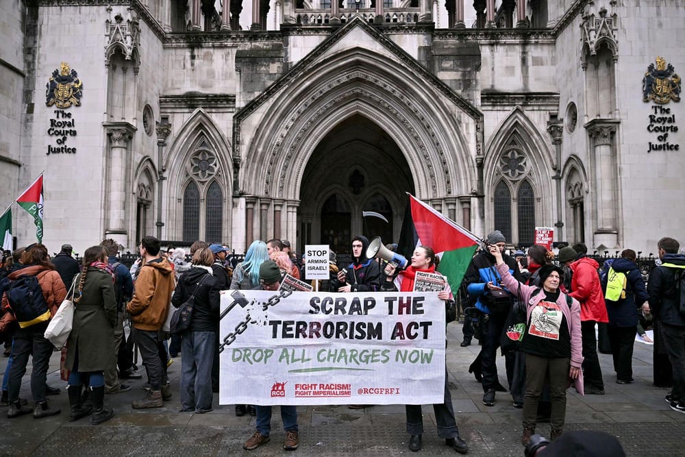 Pro-Palestinian activists celebrate Friday's decision in front of the High Court in London (Ben Stansall/AFP/Getty Images via CNN Newsource)