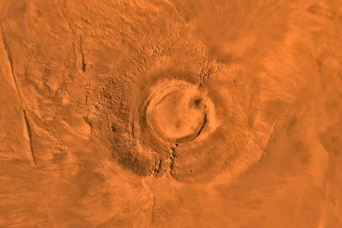 Martian volcanoes may be hiding giant glaciers under a layer of ash