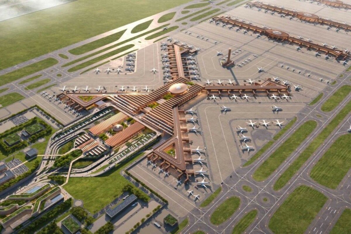 Here comes one of the largest airports in the world. Futuristic, in Africa and… in the shape of an X