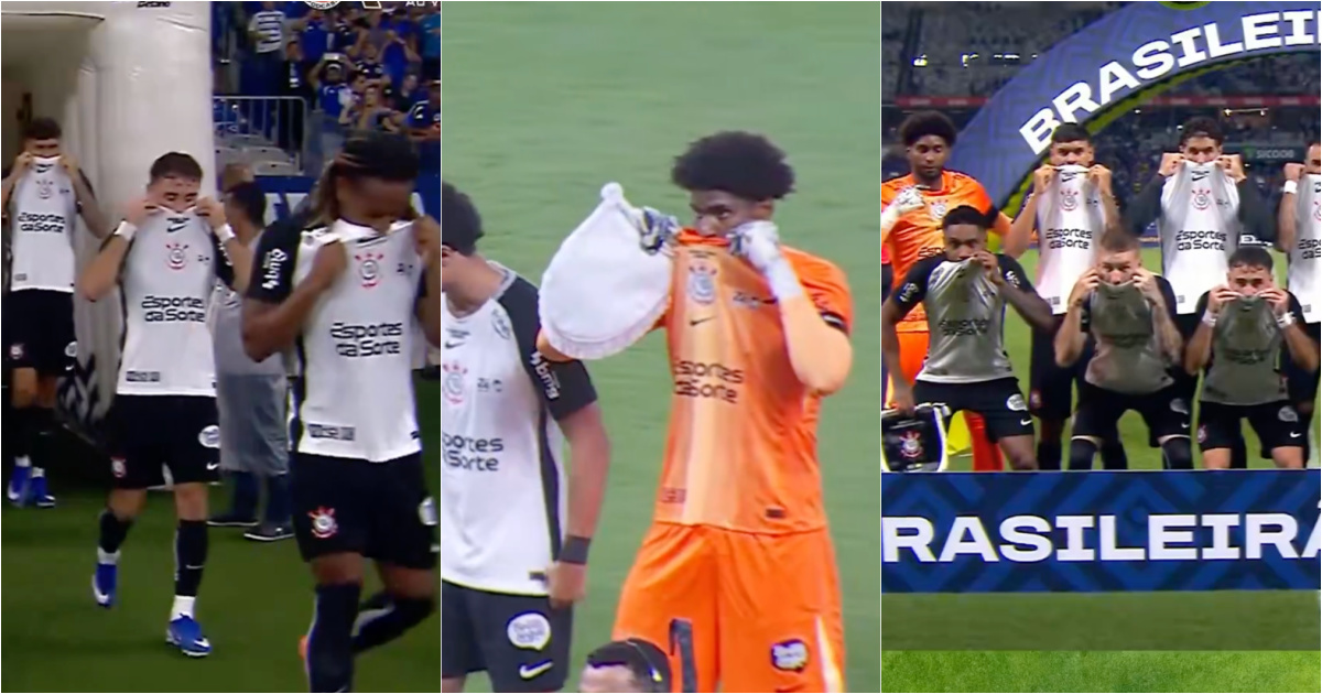 Corinthians players enter the field with their shirts covering their mouths in support of Vini Jr.