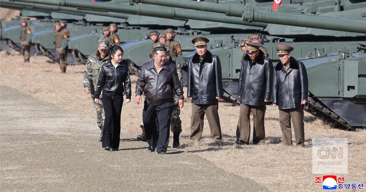 Kim Jong-un and his daughter watch a military exercise with anti-missile equipment
