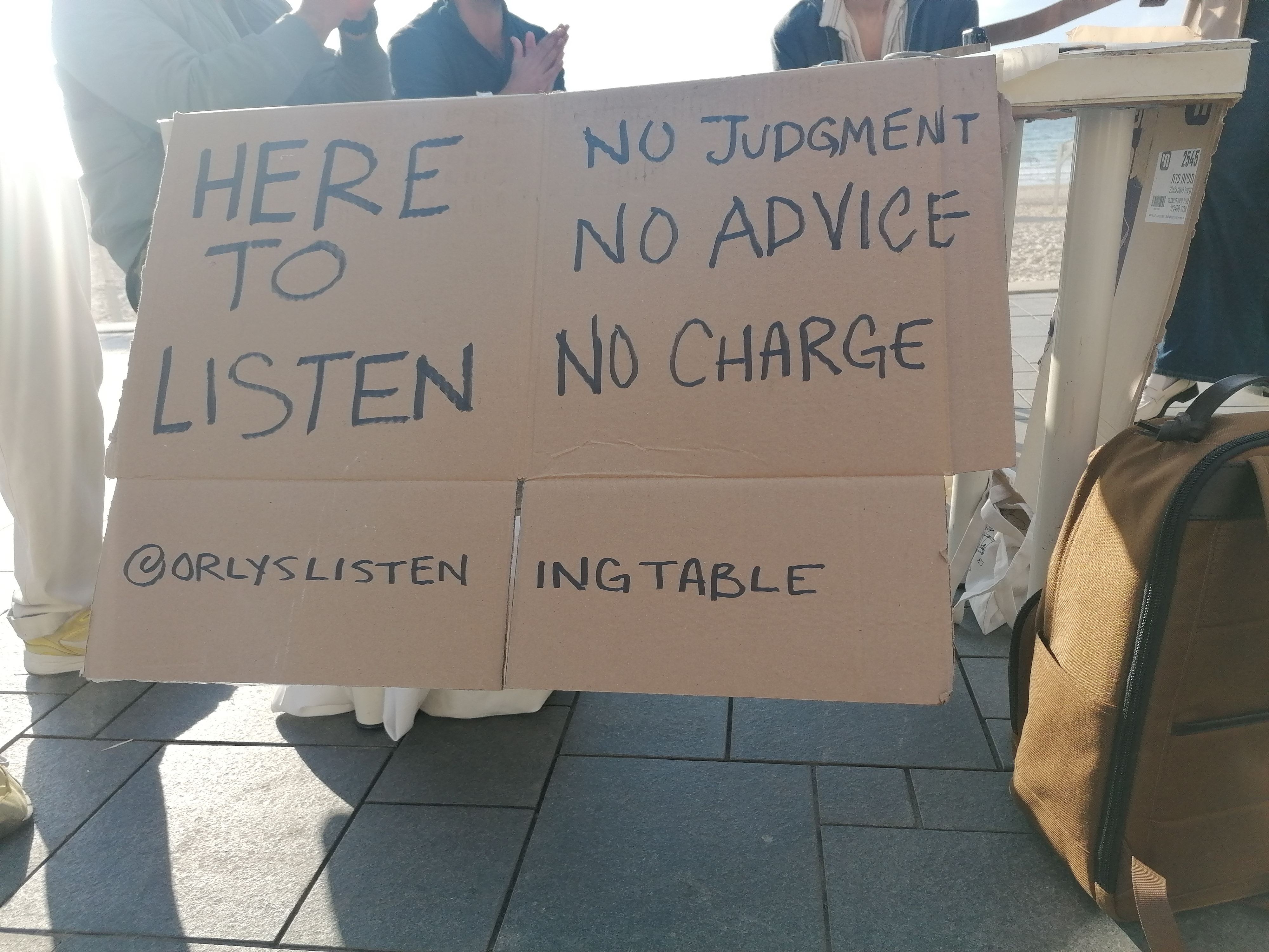 'Life must go on': Rackets, sunbathing and alarms on Tel Aviv beach