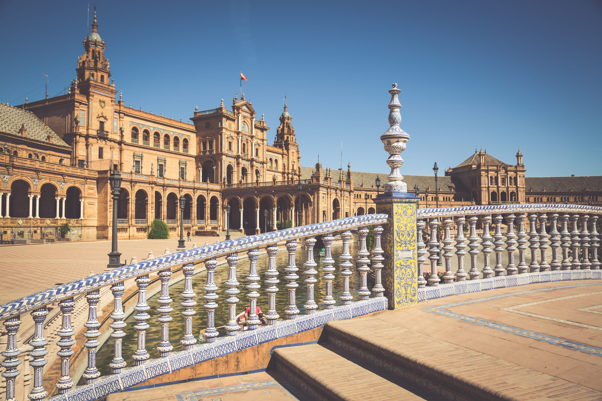 One of the cheapest cities to visit in high season is a two-hour drive from the Algarve: Seville has affordable hotels in summer