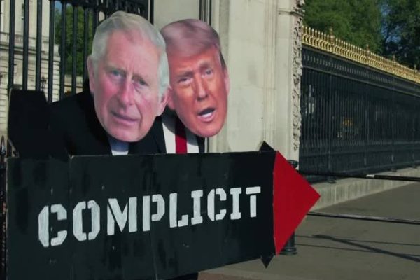 Protesters dressed as King Charles III and Trump protest against the monarch's visit to the USA
