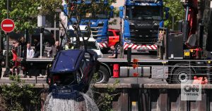 Passenger bus falls into Seine