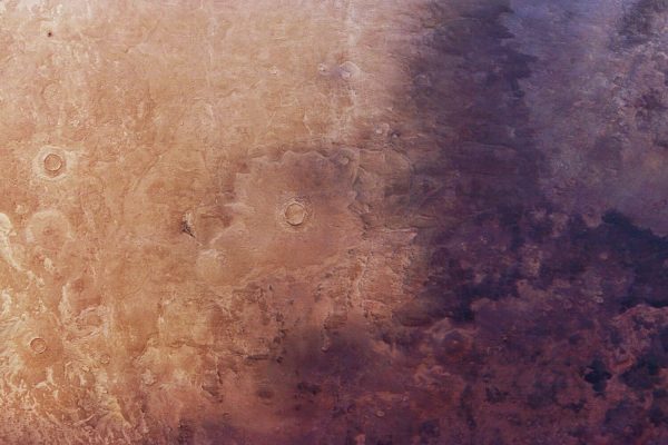 Something dark is spreading across Mars. Nobody knows what it is