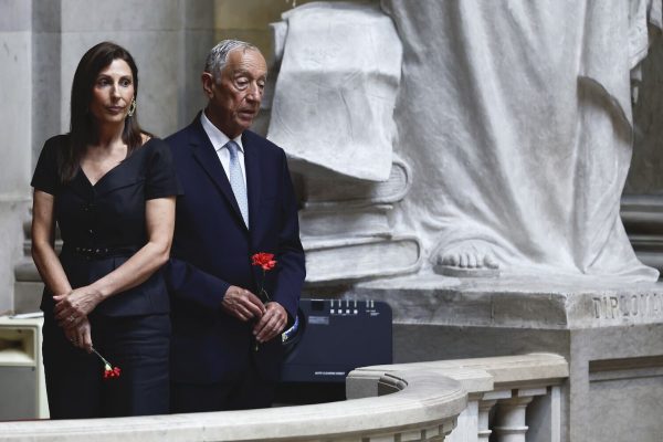 Green or red carnations, black or red dresses. It's April 25th