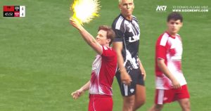 Max Fosh takes the referee's yellow card and burns it at Wembley