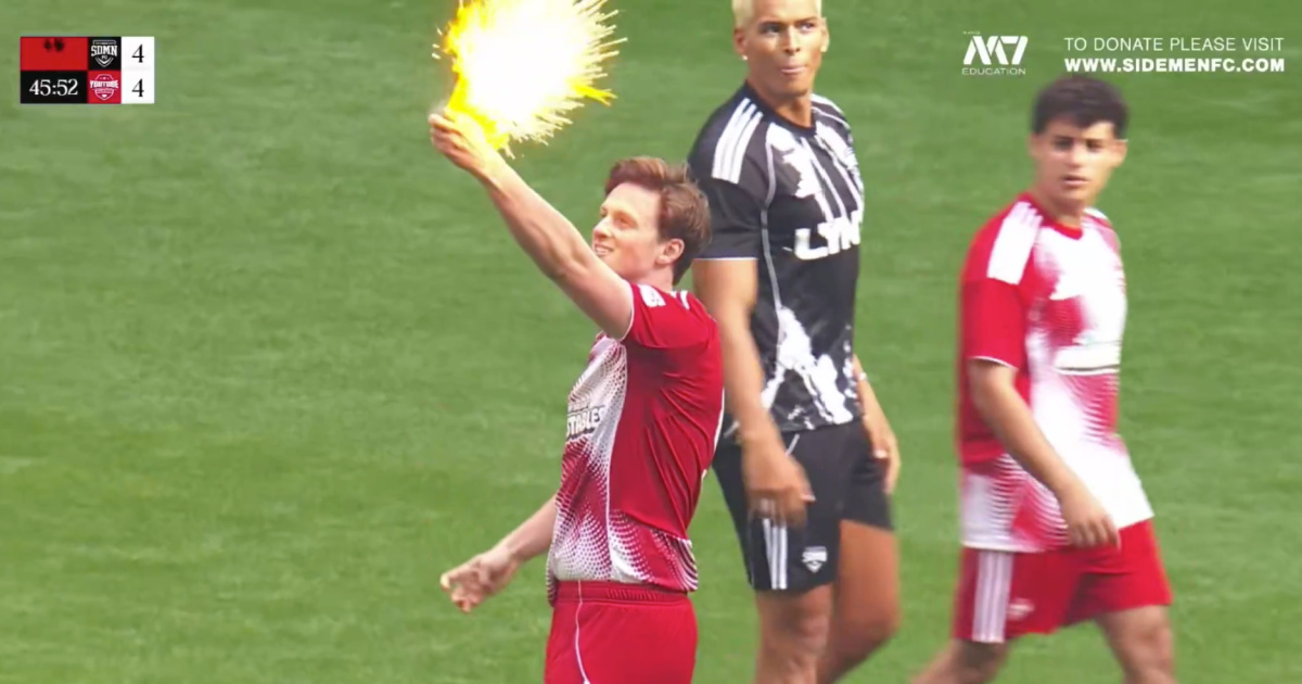 Max Fosh takes the referee's yellow card and burns it at Wembley