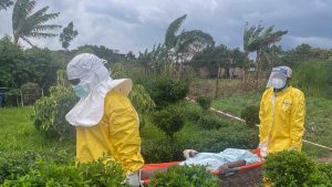 A group of protesters demanding the body of a person who died from Ebola burns down a hospital in DR Congo