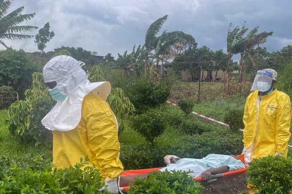 A group of protesters demanding the body of a person who died from Ebola burns down a hospital in DR Congo