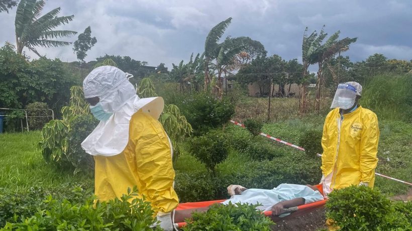 A group of protesters demanding the body of a person who died from Ebola burns down a hospital in DR Congo