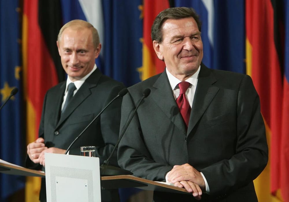 German Foreign Minister Gerhard Schröder (right) participates in a press conference with Russian President Vladimir Putin on September 8, 2005 in Berlin, Germany (Sean Gallup/Getty Images)