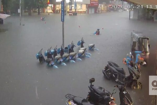 The moment a woman is saved from drowning in the middle of a flood in China