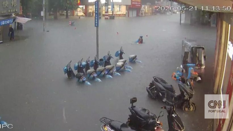 The moment a woman is saved from drowning in the middle of a flood in China
