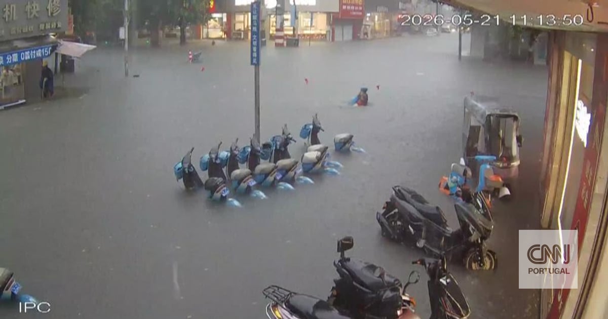 The moment a woman is saved from drowning in the middle of a flood in China