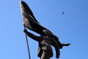 A statue of a man with a flag has appeared in London. Banksy, of course