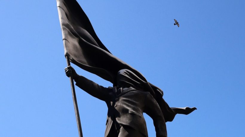 A statue of a man with a flag has appeared in London. Banksy, of course