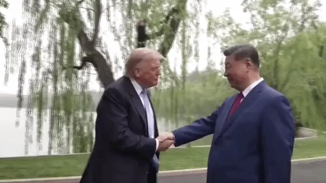 Trump and Xi shaking hands in Beijing (CCTV)