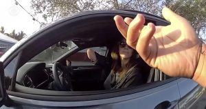 Driver accused of driving on cell phone shows arm with amputated hand