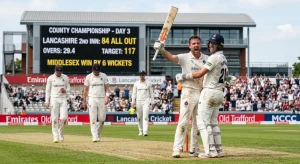 Middlesex players celebrate a wicket during the County Championship match against Lancashire at Old Trafford.