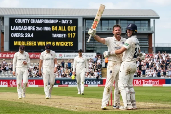 Middlesex players celebrate a wicket during the County Championship match against Lancashire at Old Trafford.