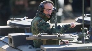 Mertz: Sent a message of reconciliation to Trump on a tank, in camouflage uniform