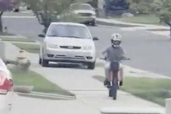 Woman drives on sidewalk to chase child on minibike
