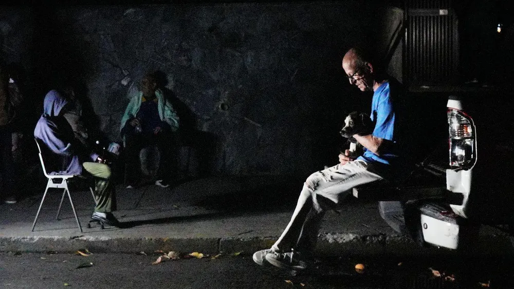 "I thought the house was going to fall on me": Daniel held on to what he could while Caracas shook. "We had a light at the end of the tunnel and now we're back to it": Susan experienced another wound from Venezuela from afar