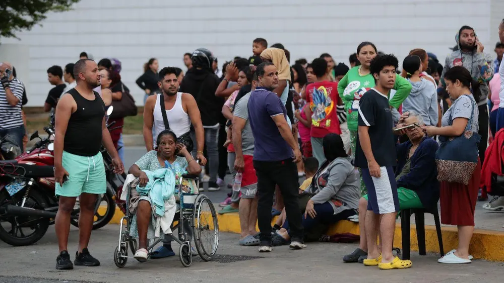 "I thought the house was going to fall on me": Daniel held on to what he could while Caracas shook. "We had a light at the end of the tunnel and now we're back to it": Susan experienced another wound from Venezuela from afar
