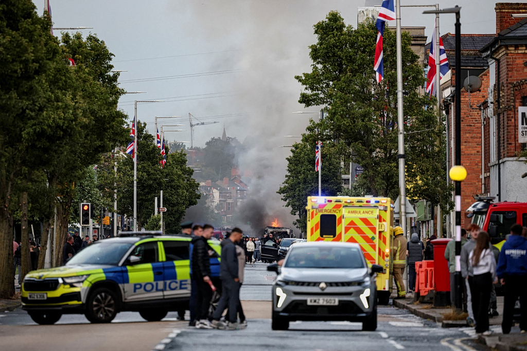 Belfast: Chaos and racist pogroms - Immigrants' homes burn after brutal stabbing