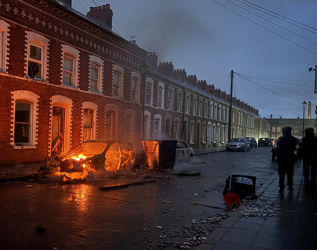 Belfast: Chaos and racist pogroms - Immigrants' homes burn after brutal stabbing