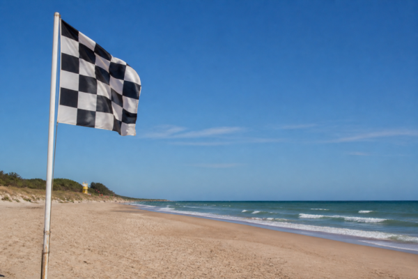 Bandeira axadrezada na praia. Crédito: Magnific AI
